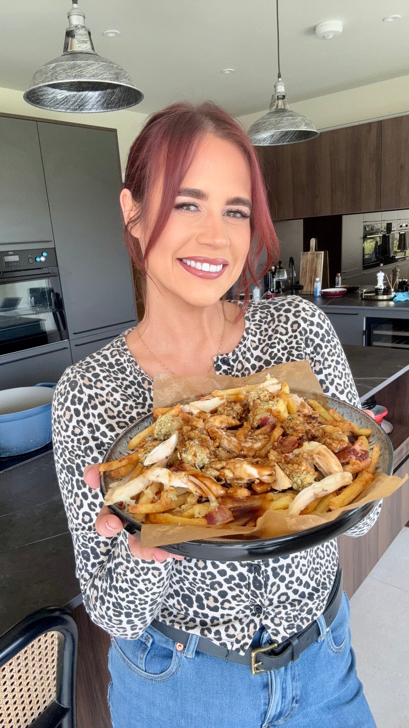 Hayley holding a bowl of food
